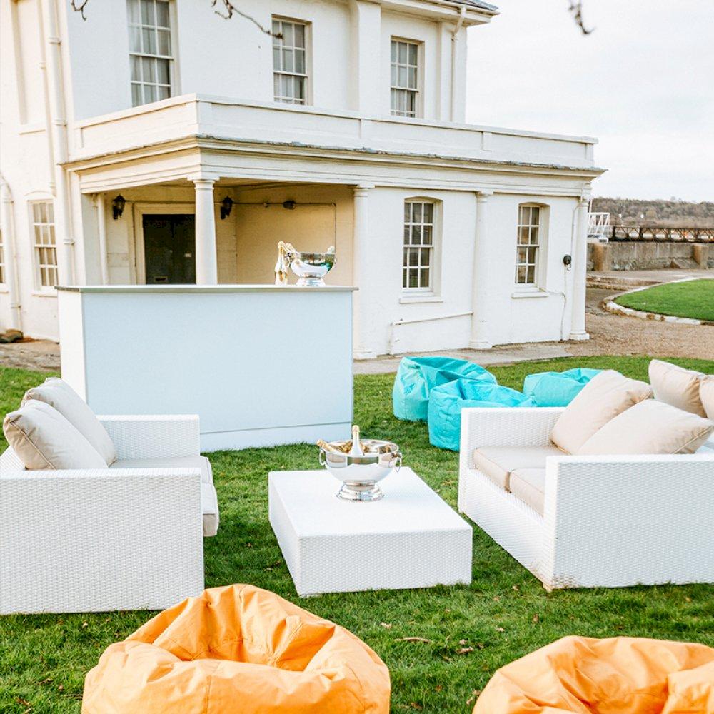 Create a fresh, outdoor space with our white rattan furniture, paired with funky bean bags for mixed seating options.